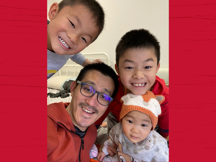 Sam Chew takes a selfie with his three children.